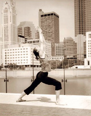 yoga in front of a city backdrop