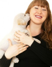 Caucasian Girl Playing With Puppy